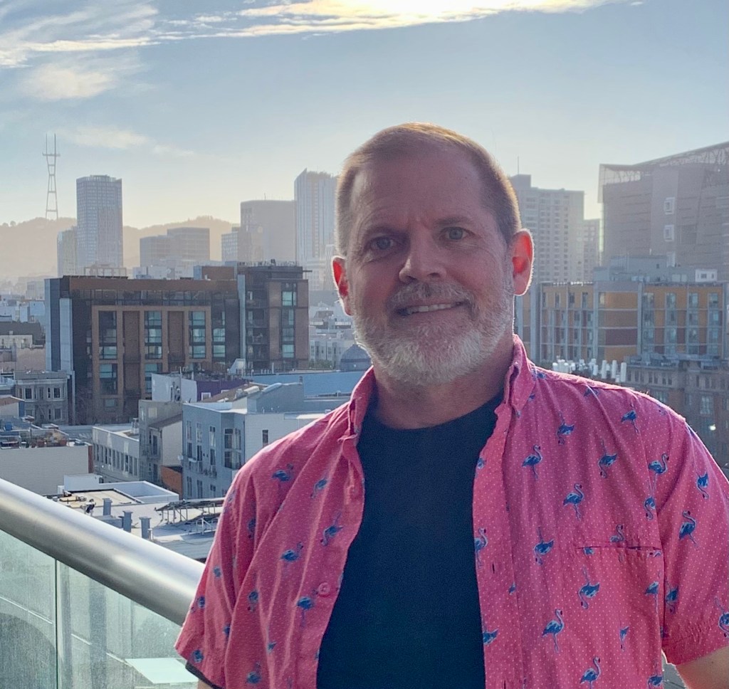 Merdhin Wylde with the San Francisco skyline behind him